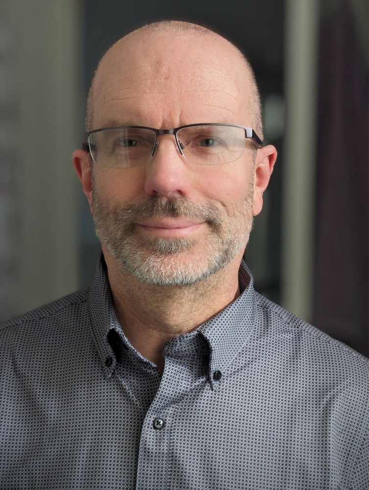 A headshot of Brian L. Plescher, founder of Sonexial.